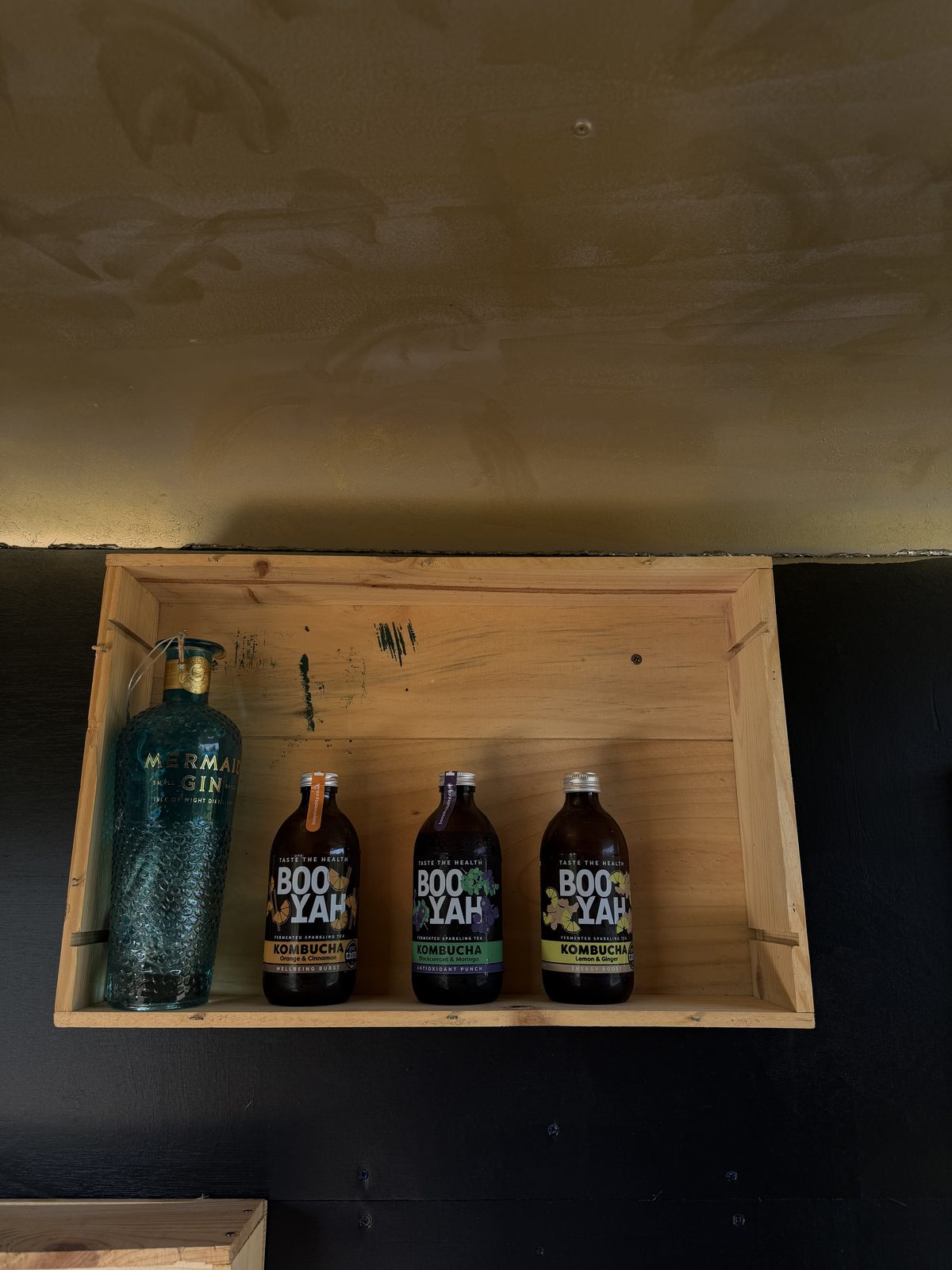 Behind the bar — spirits and kombucha shelf